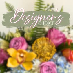 Blurred floral arrangement with "Designer's Choice" text overlay