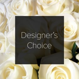Cream-colored roses with a "Designer’s Choice" label overlay