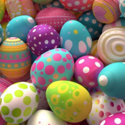 Pile of colorful decorated Easter eggs with polka dots and stripes
