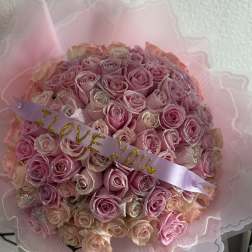 Pink rose bouquet with a lavender ribbon reading "I LOVE YOU"