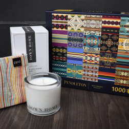 Candle, boxed candle, striped pouch, and a patterned puzzle box
