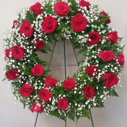 Red rose wreath with white baby's breath on a standing easel