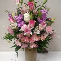 Pink and white mixed bouquet in a tall vase