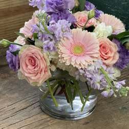 Pink and lavender bouquet in a clear glass vase