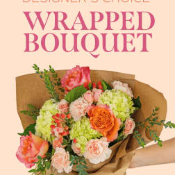 Wrapped bouquet of pink, peach, and green flowers in brown paper