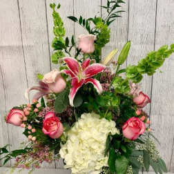 Tall bouquet with pink roses, white hydrangea, and a pink lily