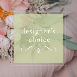 Designer’s choice floral arrangement with pale pink blooms