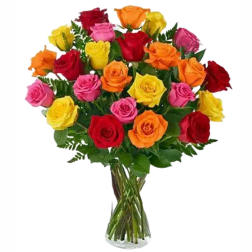 Bouquet of multicolored roses in a clear glass vase