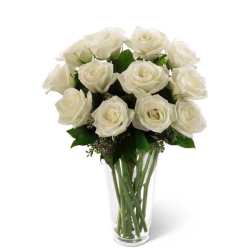 White rose bouquet in a clear glass vase