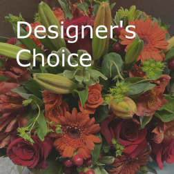 Mixed bouquet of red roses, orange gerberas, and lilies