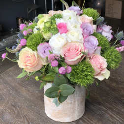Pastel rose bouquet in a stone vase
