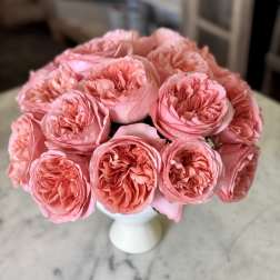 Bouquet of pink roses in a white vase