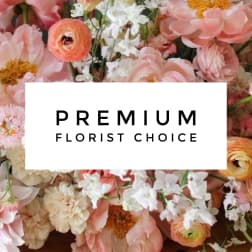 Mixed pastel flower arrangement with a "Premium Florist Choice" sign
