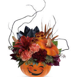 Pumpkin-shaped container with orange and burgundy flowers and curly branches