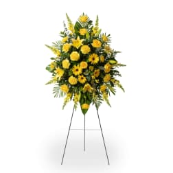 Yellow floral standing spray on a metal easel