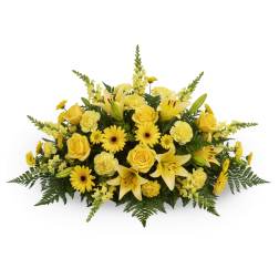Yellow floral arrangement with roses, lilies, and daisies