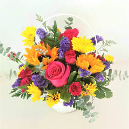 Basket arrangement of pink roses, yellow daisies, and purple flowers