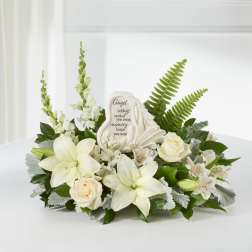 White floral sympathy arrangement with a memorial stone centerpiece