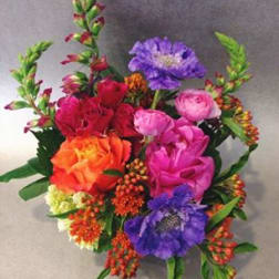 Colorful bouquet with pink, orange, purple, and red flowers