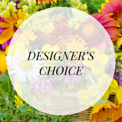 Colorful mixed flower basket with a "Designer’s Choice" label