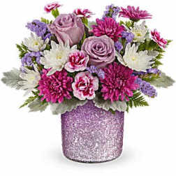 Pink and lavender flowers in a glittery vase