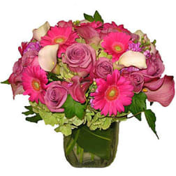 Pink and purple mixed bouquet in a glass vase