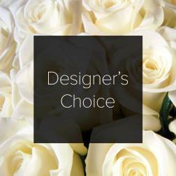 Cream-colored roses with a "Designer’s Choice" label