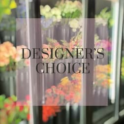 Blurred floral display with the words "Designer’s Choice" overlaid