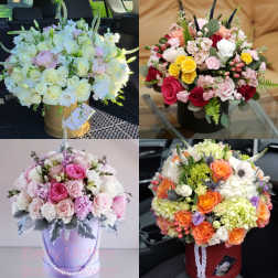Four mixed rose bouquets in decorative boxes and buckets