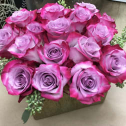 Bouquet of pink and lavender roses with succulent accents