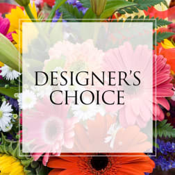 Colorful mixed flowers with a "Designer’s Choice" label overlay