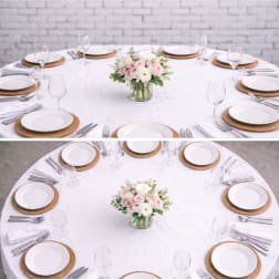 Round table centerpiece with pink and white flowers in a glass vase