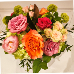 Mixed bouquet of roses, peonies, and green hydrangeas
