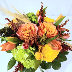Bouquet of orange roses, yellow tulips, and green hydrangeas