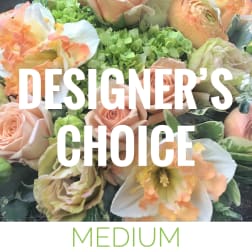 Peach and white floral arrangement with green hydrangeas