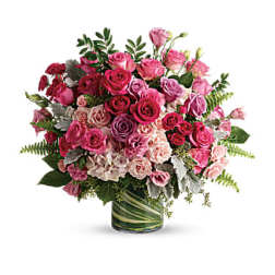 Pink and red rose bouquet in a glass vase