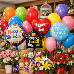 Balloon bouquet with flower arrangements and a teddy bear gift basket