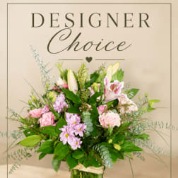 Pink and white mixed flower arrangement in a glass vase
