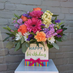 Mixed bouquet in a birthday gift box with roses, gerbera daisies, and carnations