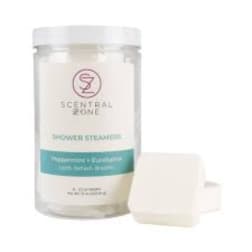 Scented candle in a clear jar with a white lid