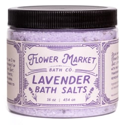 Jar of lavender bath salts with a black lid