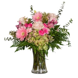 Pink and white mixed bouquet in a clear glass vase