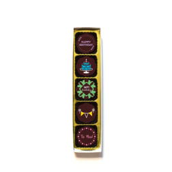 Box of birthday chocolates with decorative message toppers
