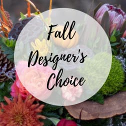 Fall floral arrangement with roses, chrysanthemums, and protea