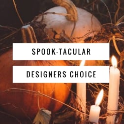 Halloween pumpkins with lit candles and spooky twigs
