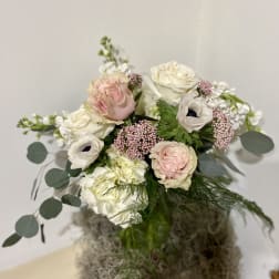 Bouquet of blush and white flowers with round eucalyptus leaves