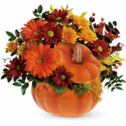 Pumpkin-shaped floral arrangement with orange and red daisies