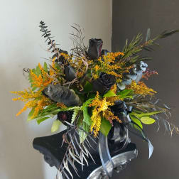 Black roses with yellow filler flowers and eucalyptus in a black wrap