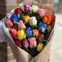 Bouquet of multicolored roses wrapped in brown paper