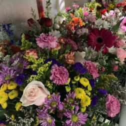 Mixed bouquet with pink, purple, yellow, and white flowers